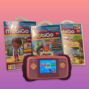 🎁 Vtech Mobigo Console 4 Games Team Umizoom,Dora, Doc McStuffins and Game Pack